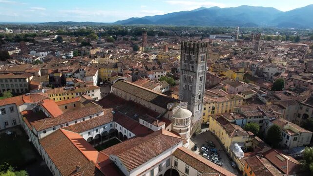 Aerial 4K view of Lucca defensive walls and historic tower near the promenade. cinematic slow drone view of  famous renaissance city walls, Tuscany. Italy