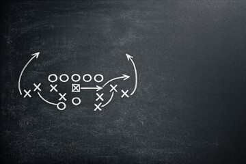 Obraz premium Chalkboard displays football play strategy with Xs and Os arranged for Super Bowl game preparation and planning