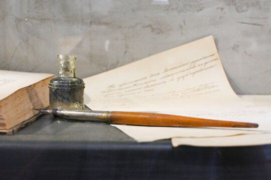Open old diary or notebook with classic pen.