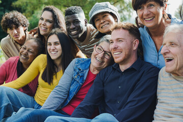 Fototapeta premium Crowd of multiracial people having fun together at city park - Social gathering and multi generational community concept