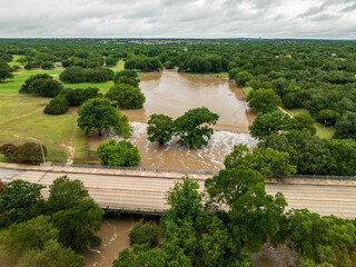 Aerial view of flooding in Georgetown Texas after heavy rainfall in July 2025 showing trees submerged and water over roadways