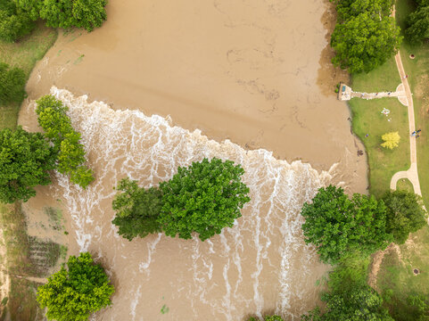 Aerial view of flooding in Georgetown Texas after heavy rainfall in July 2025 showing trees submerged and water over roadways