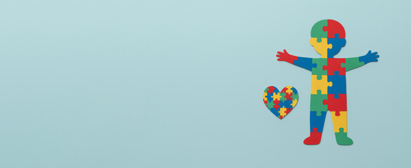 Autism Awareness Day puzzle illustration with child silhouette and heart on blue background