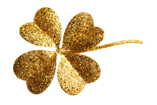 gold glitter shamrock on black background for st patrick s day