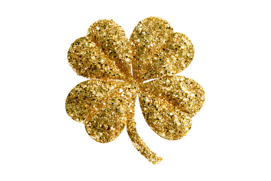 gold glitter shamrock on black background for st patricks day