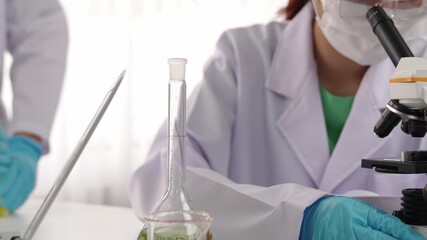 Laboratory researcher develop new medicine or cure use colorful chemical liquid in lab tube. Technological advance of healthcare with microbiology expertise and laboratory equipment. Rigid. - Powered by Adobe