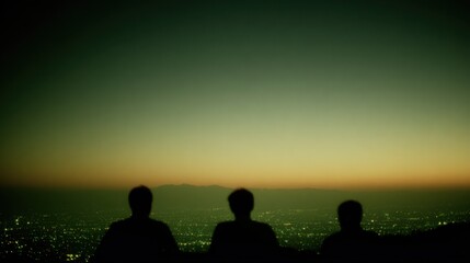 Three silhouettes overlook a sprawling cityscape at twilight, with a gradient sky transitioning from green to orange, evoking a sense of peace and contemplation.