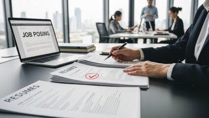 Focused professional analyzing business data and financial reports on laptop and smartphone, optimizing workflow and productivity in a modern office environment