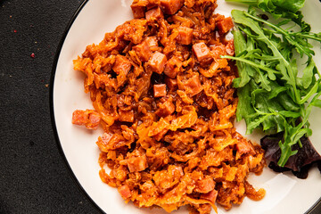 Stewed cabbage with ham cube tomato sauce braised cabbage vegetable healthy food main course ingredient appetizer fresh tasty table setting gourmet food background on the table rustic food  