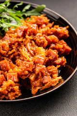 Stewed cabbage with ham cube tomato sauce braised cabbage vegetable healthy food main course ingredient appetizer fresh tasty table setting gourmet food background on the table rustic food  