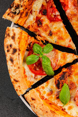 Pizza tomato margarita fast food natural product tasty snack fresh delicious gourmet food background on the table rustic top view copy space