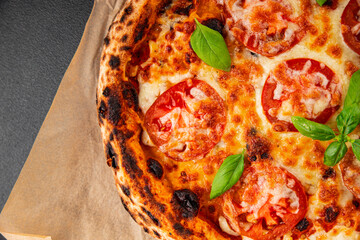 Pizza tomato margarita fast food natural product tasty snack fresh delicious gourmet food background on the table rustic top view copy space