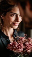 A man presents a woman with a bouquet of bright flowers, dramatic black background, strong emphasis on the colorful bouquet, faces partially hidden or out of focus, elegant minimalist composition