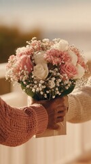 A man presents a woman with a bouquet of bright flowers, dramatic black background, strong emphasis on the colorful bouquet, faces partially hidden or out of focus, elegant minimalist composition