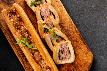 pate en crout in pastry natural baking healthy food main course ingredient appetizer fresh tasty table setting gourmet food background on the table rustic food top view copy space