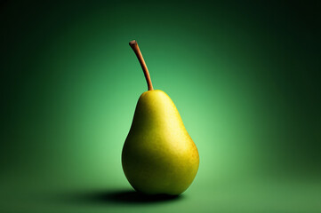 A perfectly shaped, ripe green pear stands isolated and dramatically lit against a deep emerald green gradient studio background.