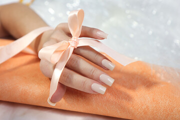  A woman with a milky manicure.