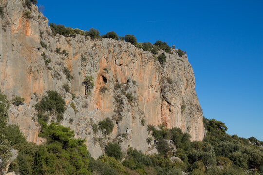 Rock climbing crag area in Geyikbayiri, Turkey. Rock climbing spot near Antalya. Geyikbayiri rockclimbing area crag in Turkey. Tuffa rock walls and caves spectacular view landscape Spectacular Cave