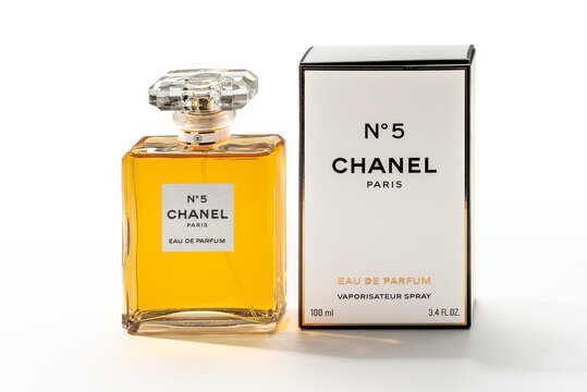 Italy - January 3, 2026: Chanel N&deg;5 eau de parfum 100 ml (3.4 FL.OZ.) spray bottle near the classic cardboard packaging, Fragrance perfume CHANEL