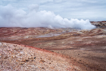 Hot water vapor rises from the Gunnuhver geothermal area on the Reykjanes Peninsula on a day in March.