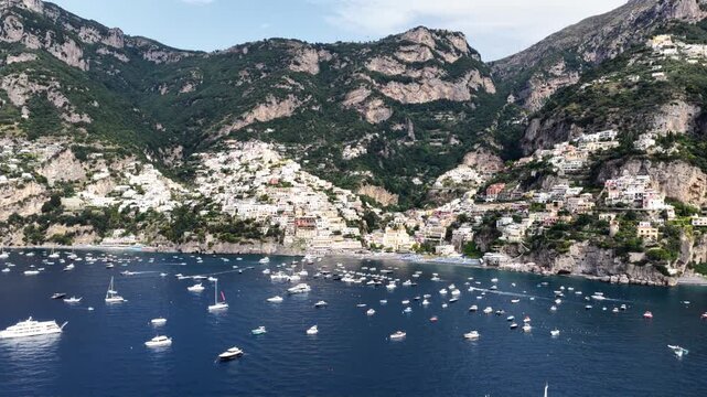 Aerial daytime view of boats and buildings in Positano Italy