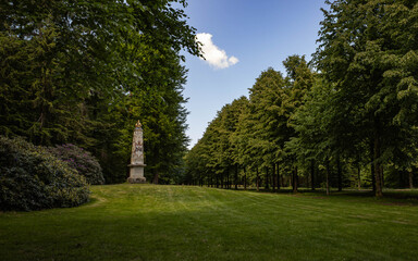 Panorama with a monument in the park of the royal palace museum in Apeldoorn