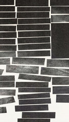 handmade collage background featuring irregular black paper strips arranged in a brick-like pattern on a white surface. The composition has a minimalist, modern aesthetic with visible paper texture.