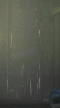 Faint light filters through a dusty hallway, highlighting peeling walls and neglected corners. A vending machine stands quietly, hinting at past activity in this eerie space.