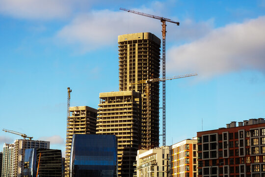 Dynamic urban landscape highlighted by developing structures and gleaming exteriors