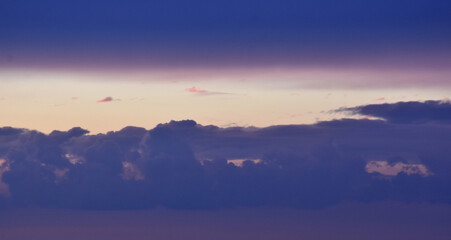 Breathtaking purple sunset sky with soft pink cloud layers