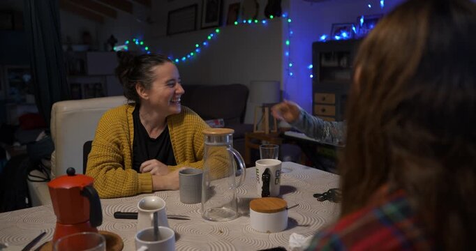 During the impostor game, the mother responds to her children's accusations with humour and gestures.