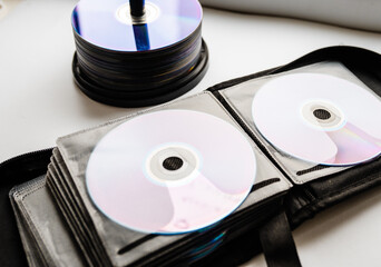 Bunch of CD and DVD discs organized in a disc holder.