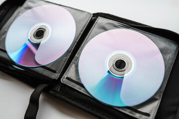 Bunch of CD and DVD discs organized in a disc holder.