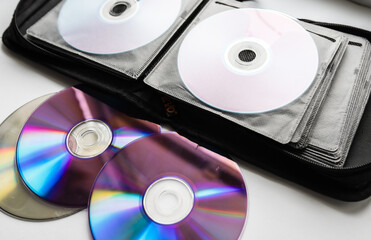 Bunch of CD and DVD discs organized in a disc holder.