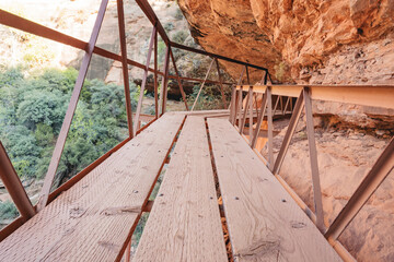 selective focus on boards and rail of elevated walkway on the Canyon Overlook Trail in Zion National Park, Utah.