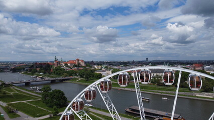 Aerial view of historic architecture and urban landscape in Poland, showcasing European cityscape, river and landmarks.