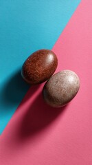 toffee and cyan pebble duo on smooth gradient background