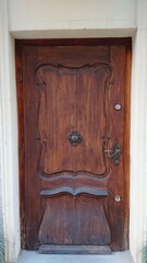 Historic wooden door with carved details