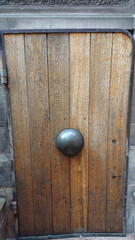 Historic wooden door with metal boss in Gdansk