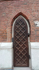 Gothic wooden door with carved geometric pattern