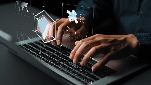 Hands typing on a laptop with digital interface displaying charts and data analysis in an office setting, showcasing technology and innovation in business Gluon. - Powered by Adobe