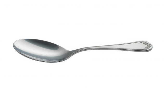 Classic silver plated tablespoon featuring elegant decorative etching on the handle end on transparent background