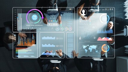 A professional business meeting featuring a team analyzing digital dashboards and data visualizations, highlighting modern technology and teamwork in a collaborative setting. Raster