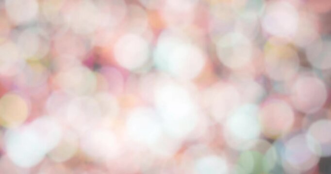 Stop-motion of blurred pastel bokeh circles in soft multicolors, radiating joy, warmth, and lightness in a dreamy, romantic style.