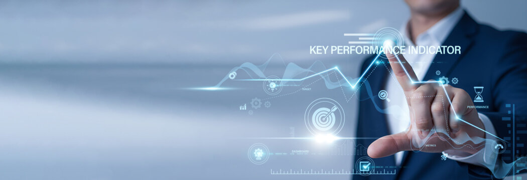 Data analyst pointing at data network and KPI on digital interface. Key Performance Indicators, business metric tracking, goal achievement, and corporate success analytics.