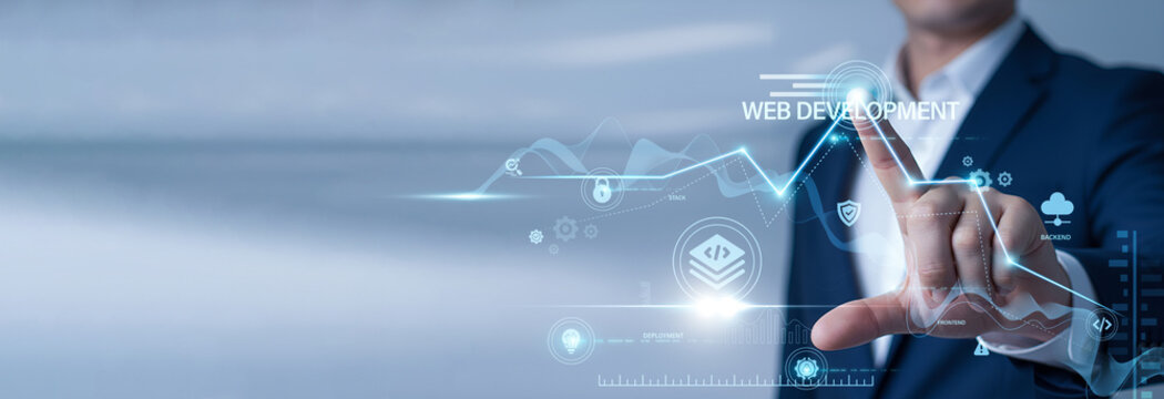 Businessman pointing at data network and Web Development on digital interface. UI/UX design, frontend coding, backend architecture, and digital platform engineering.
