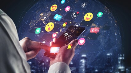 Hands Holding Smartphone with Social Media Icons Overlaid on a Global Network of Connections and Communication Symbols Gluon.
