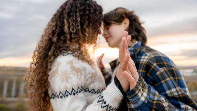 Young LGBTQ couple embracing love and Pride