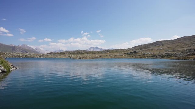 Calm Blue Totensee Lake with Mountain Peaks at Grimsel Pass Switzerland.Filmed on 30 July 2025.