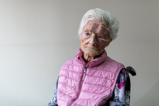Elderly woman in residence with bandaged facial wound